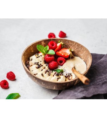 Miska z kokosu a lžíce na snídaně, mysli, kaše a bowl